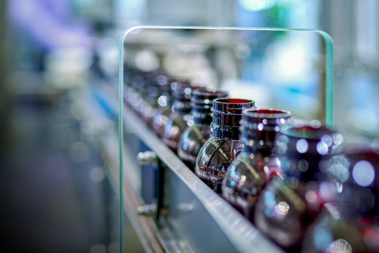 ey-close-up-of-brown-glass-medicine-bottles-at-production-line